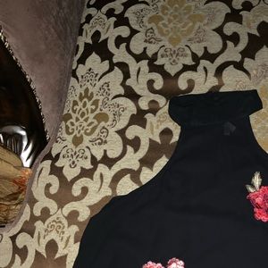 Black sheer blouse with neck strap and rose acc